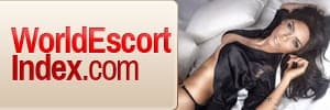 Banner ad for WorldEscortIndex.com showing a woman in lingerie beside the site logo.