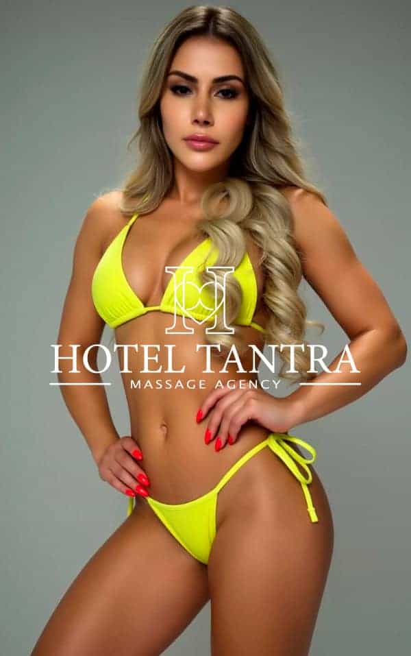 blanca-Happy-ending-madrid - Erotic Massage & Outcall Massage in Madrid Model in a neon yellow bikini posing with hands on hips; watermark reads 'Hotel Tantra Massage Agency' across the torso.