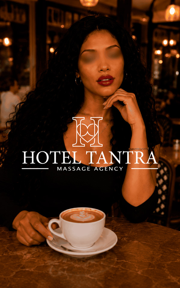 Promotional image for Hotel Tantra Massage Agency featuring a woman at a cafe with a cup of coffee and a logo overlay reading HOTEL TANTRA.