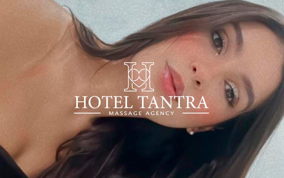 Portrait of a woman with a centered white logo reading 'HOTEL TANTRA' and 'MASSAGE AGENCY' overlaid on the image.